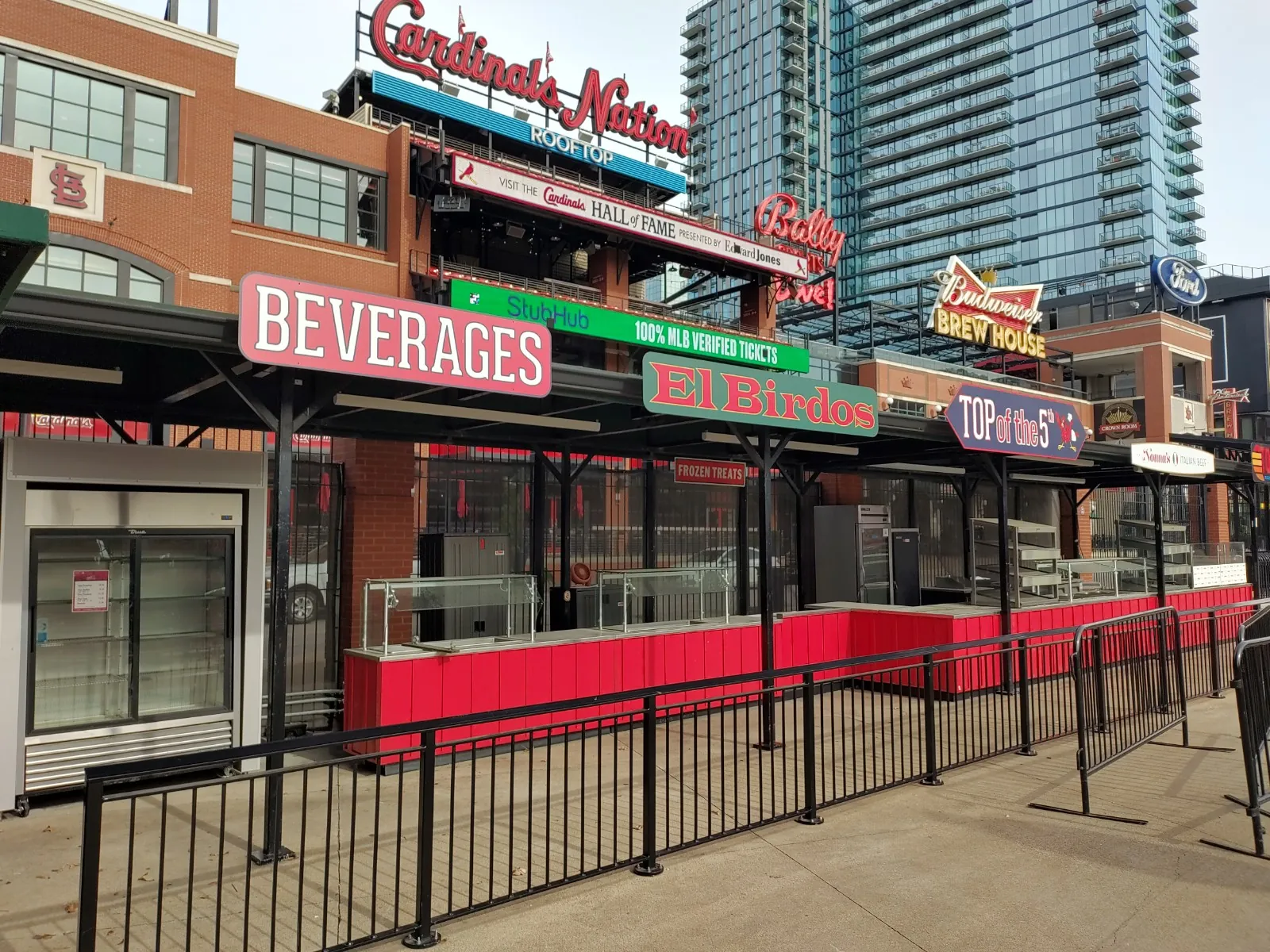 Exterior Beverages, El Birdos, and Top of the 5th red service counters under the Cardinals Nation rooftop sign